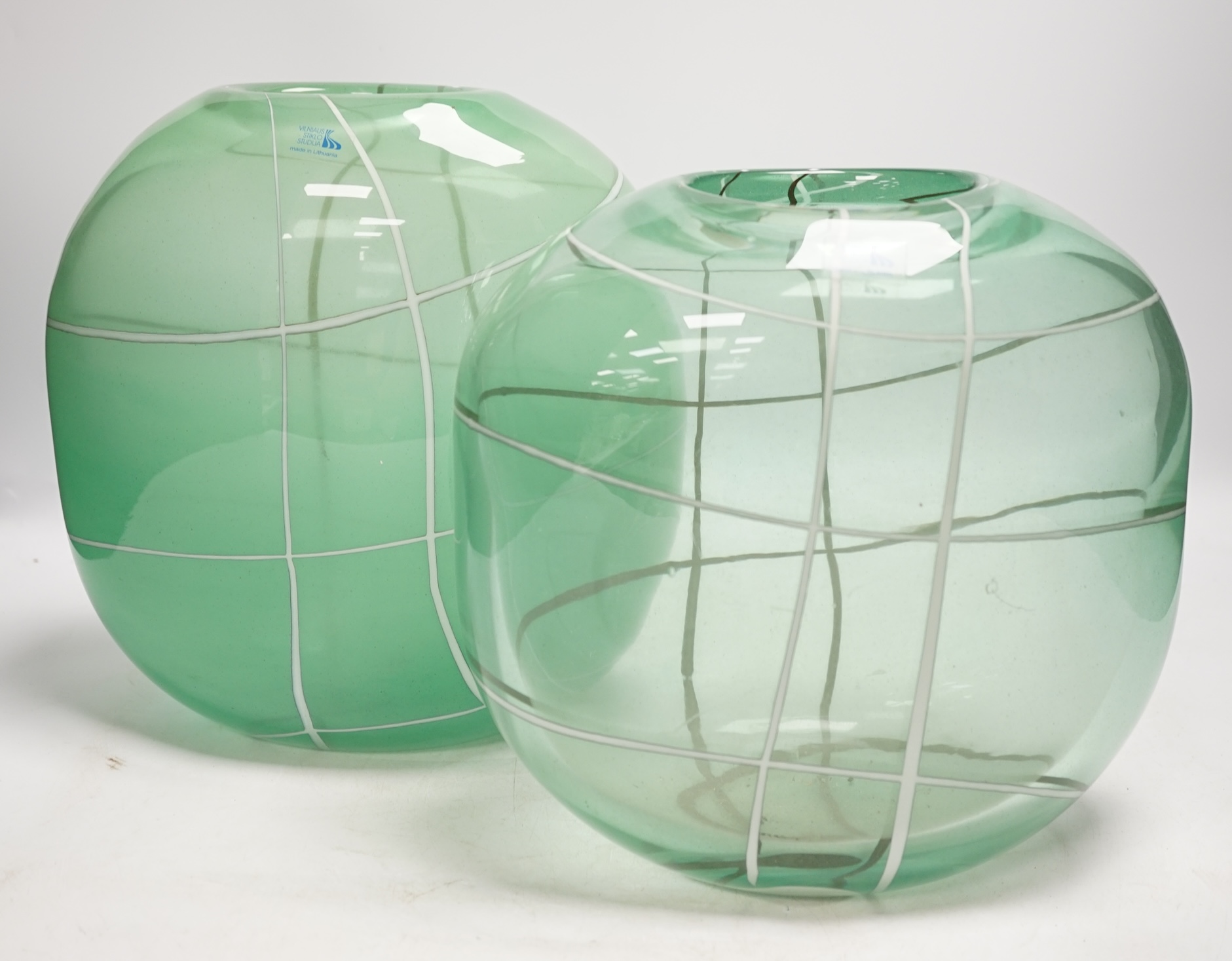 Two Lithuanian, Vilnius Studio green and white art glass vases, with labels, tallest 26.5cm high. Condition - fair to good